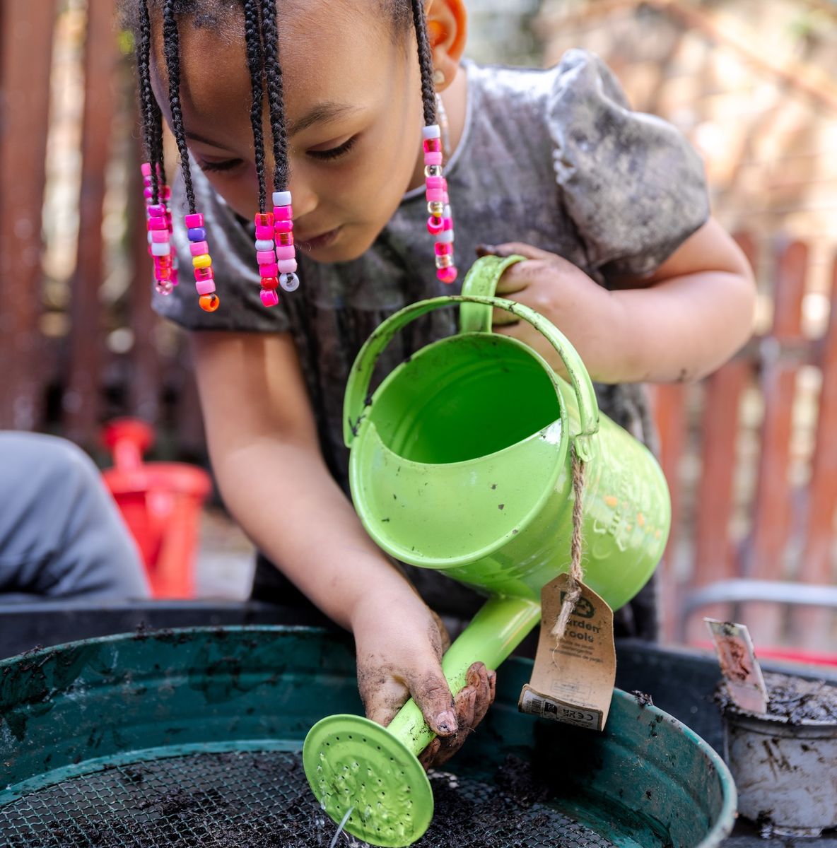Girl with watering can