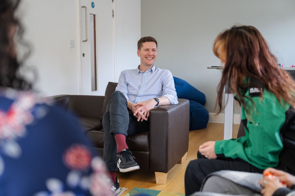 Hostel manager with residents