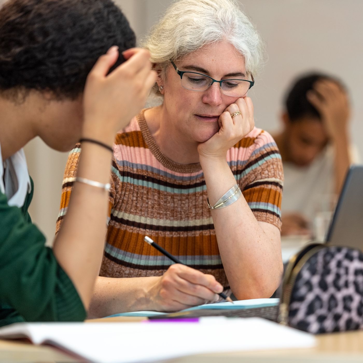 Volunteer working with a young person