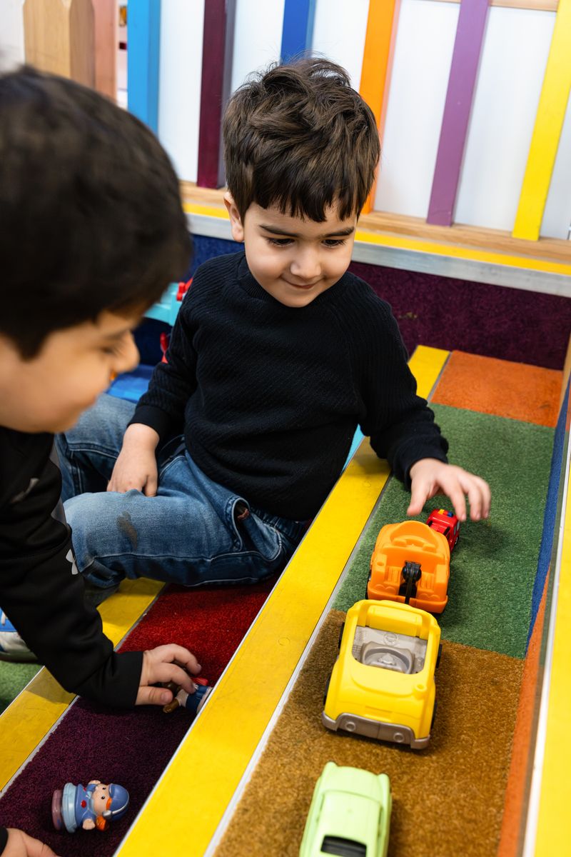 Boys playing with cars
