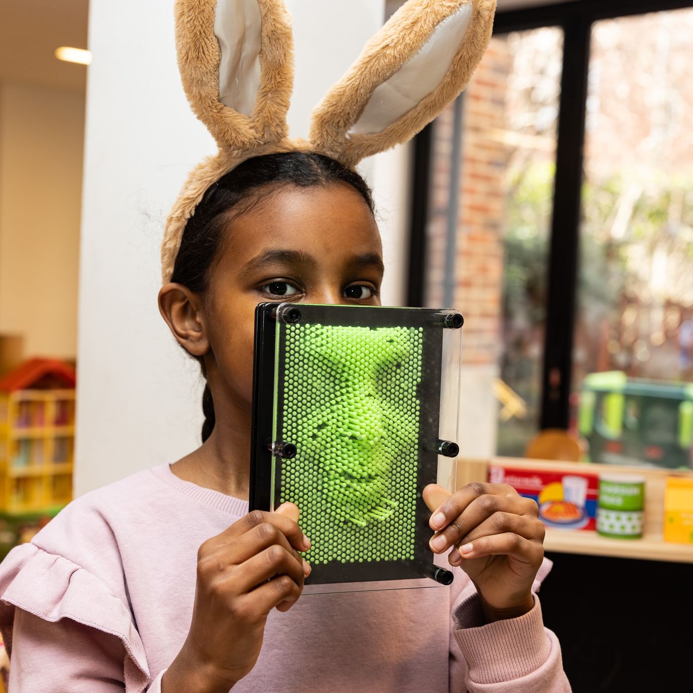 Child wearing bunny ears 260217_CHC-7662-crop