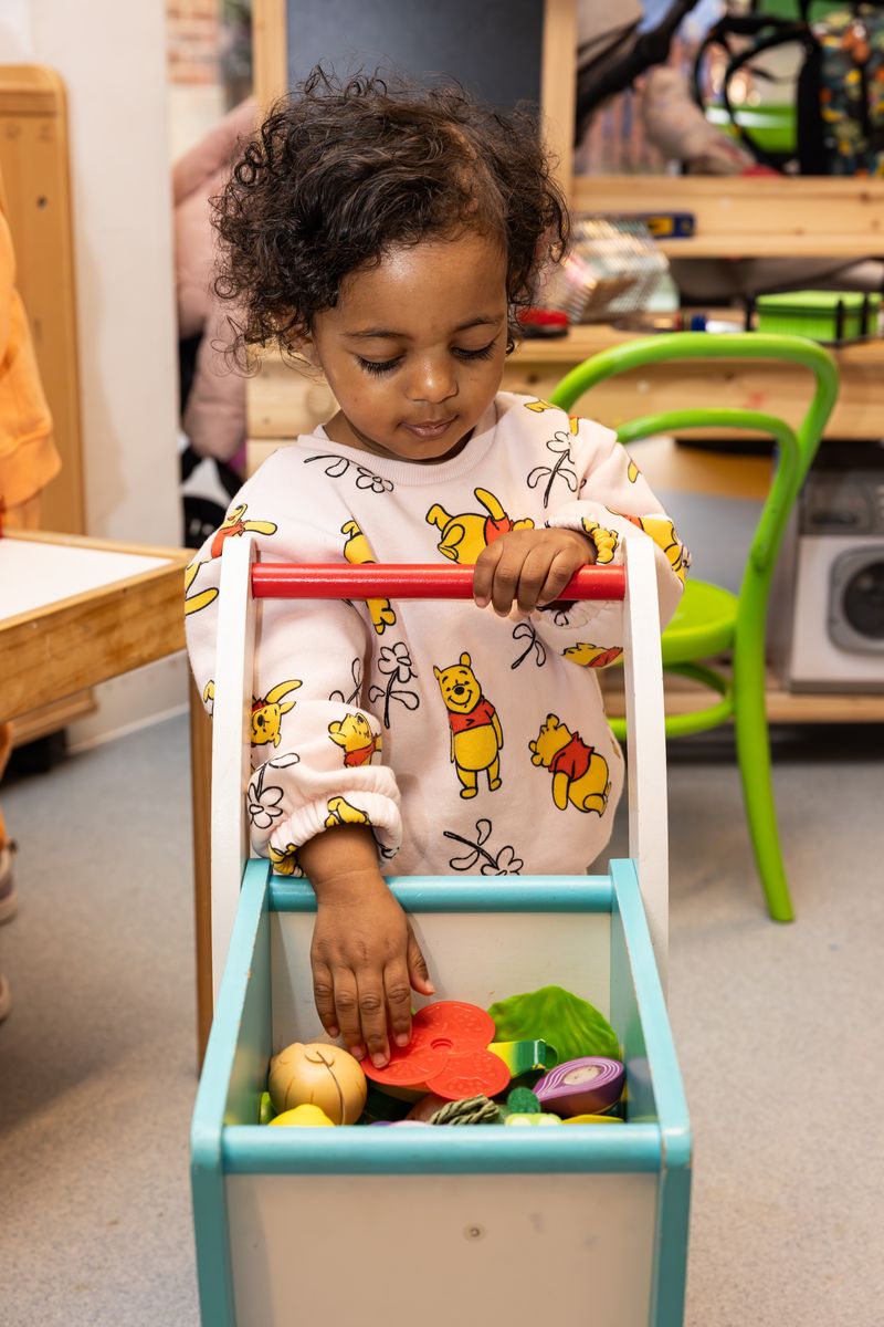 Young girl with shopping trolley