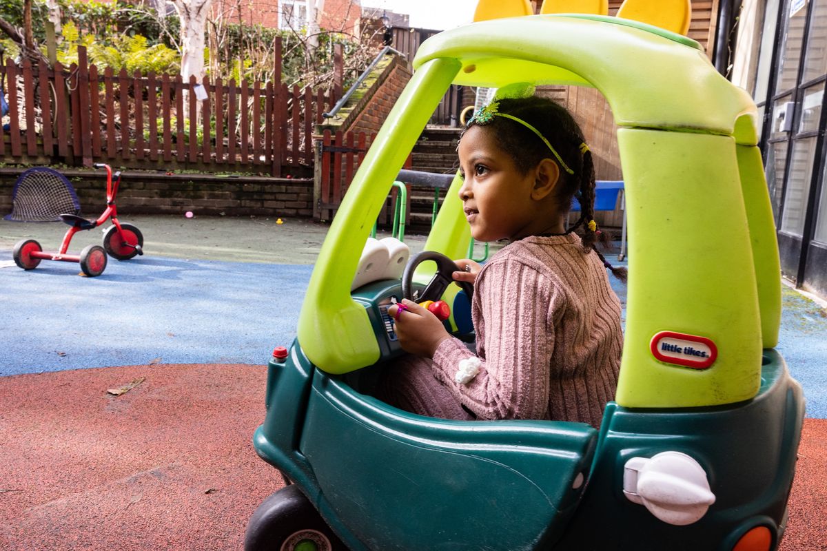 Child in toy car