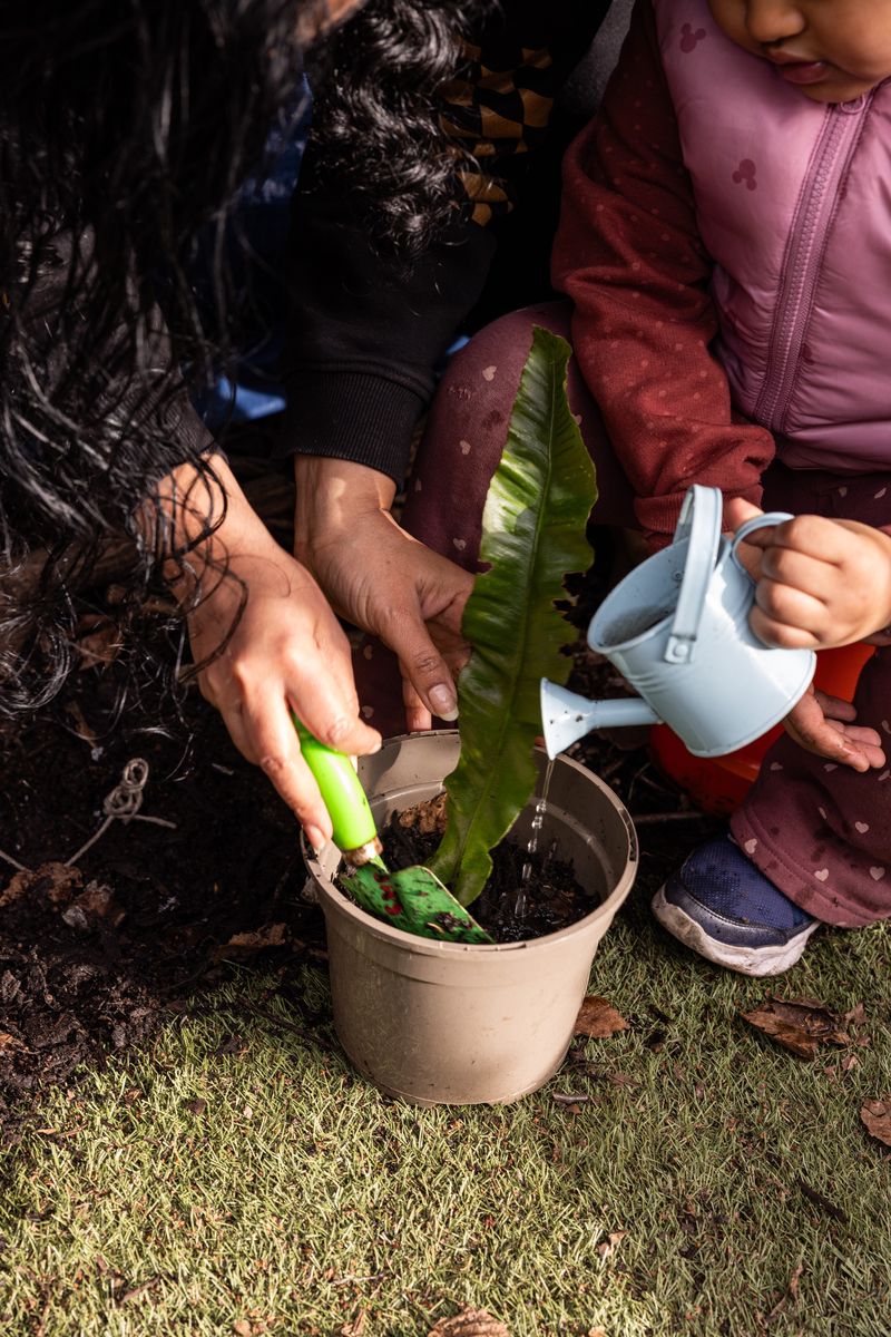 Mother gardening with daughter