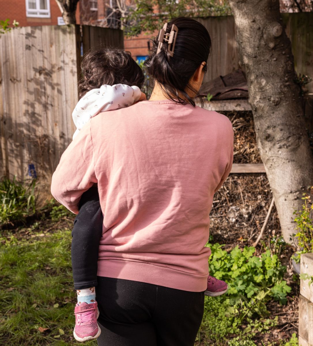 Mother carrying child
