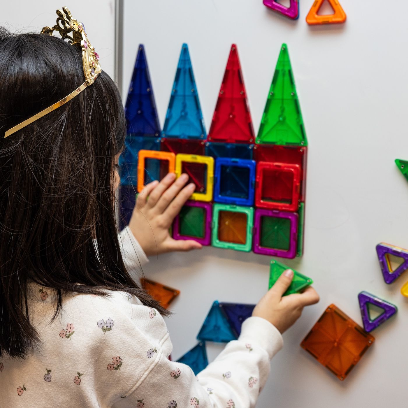 Child playing with magnetic toys