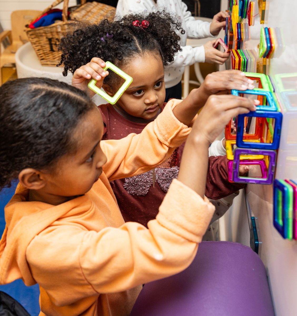 Children playing with magnetic toys