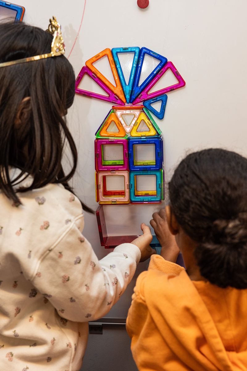 Children playing with magnetic toys