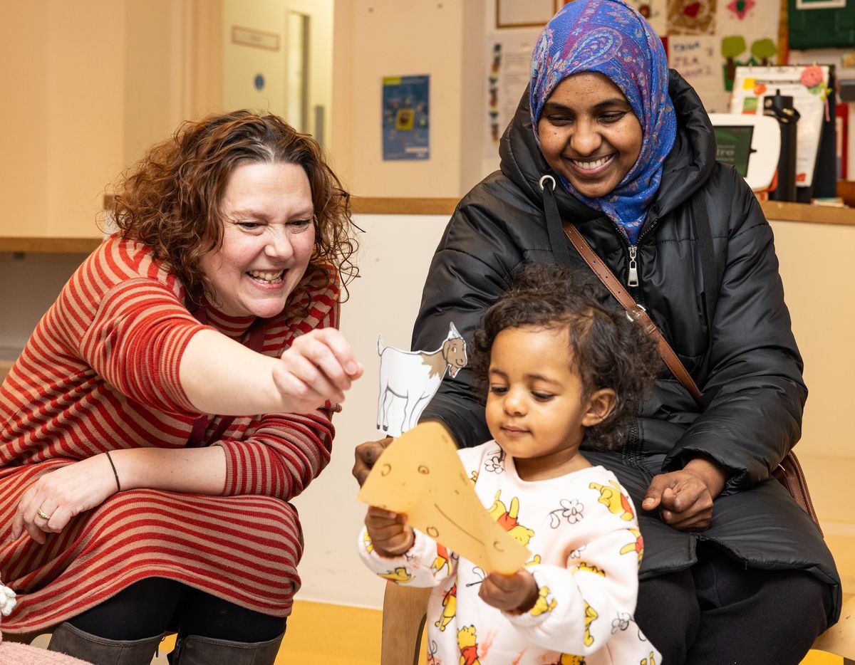 Family services practitioner with mother and child