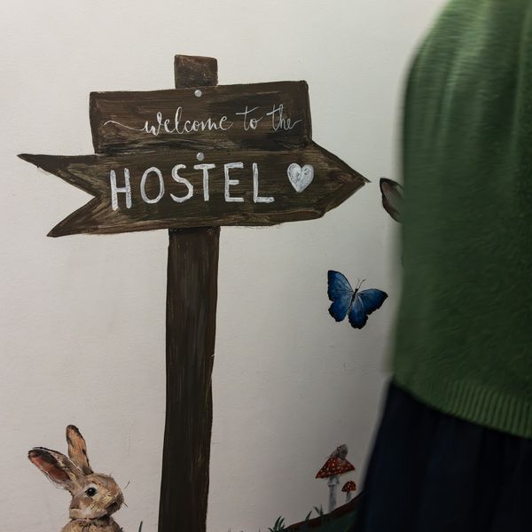 Welcome to the hostel sign