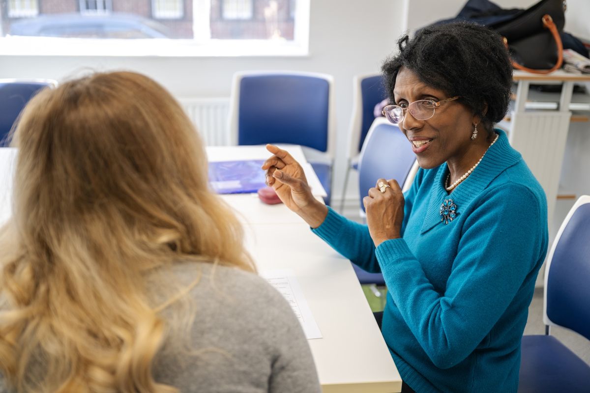 Teacher and young person learning ESOL