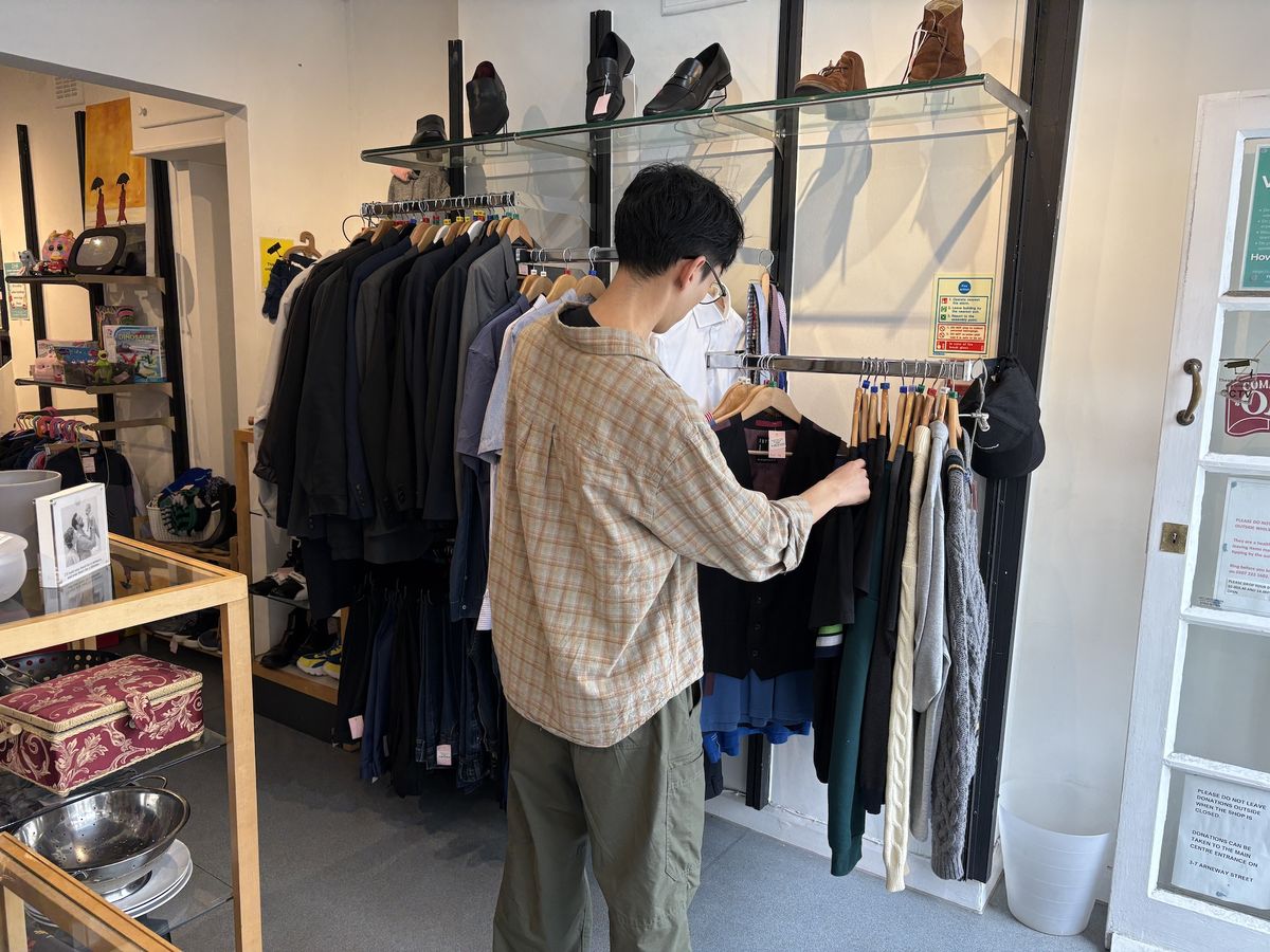 Shopper browsing in the charity shop