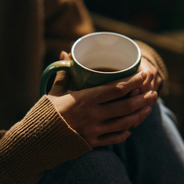 woman holding mug stock photo